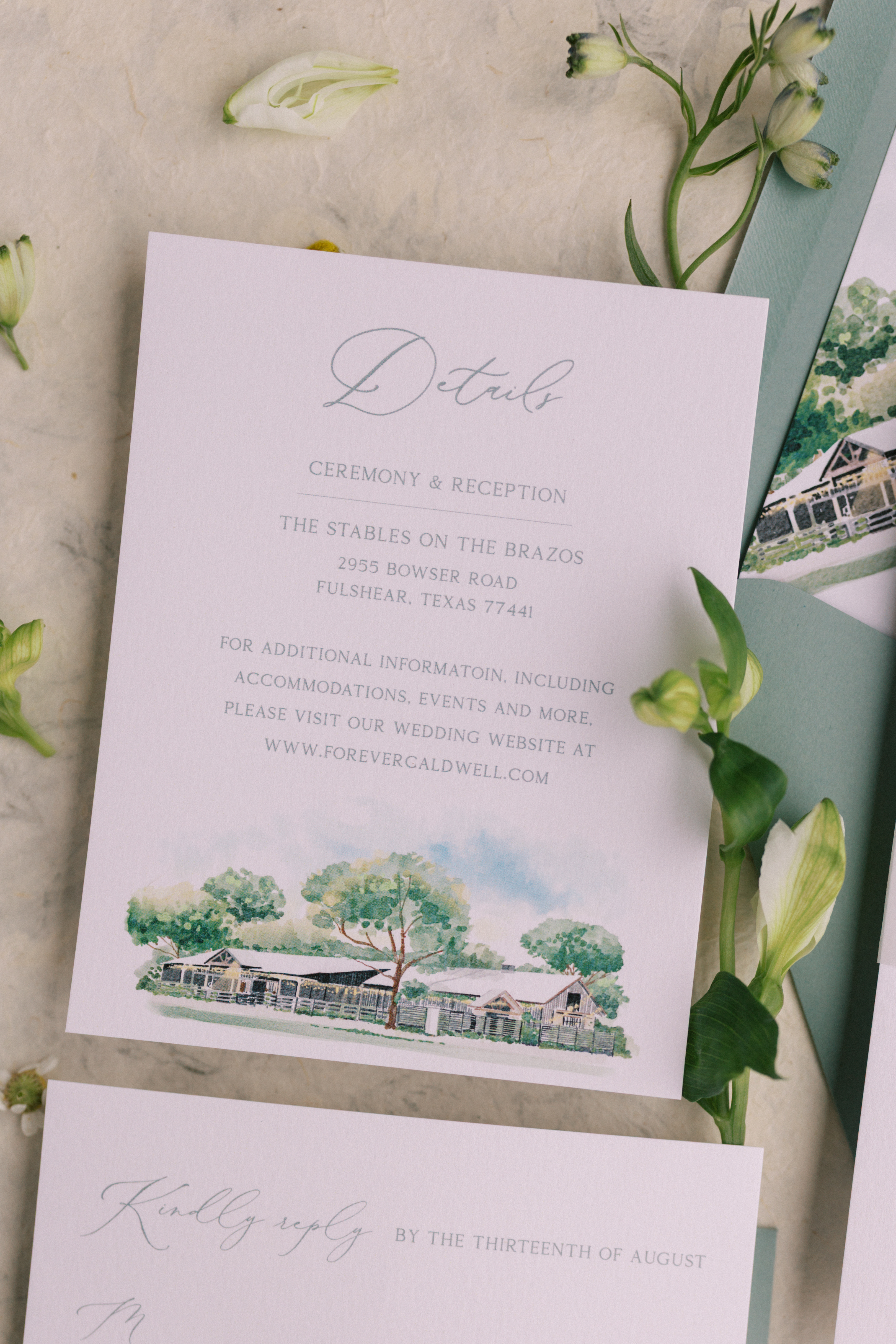 Wedding details card with a watercolor venue painting, ceremony information, and sage green envelope
